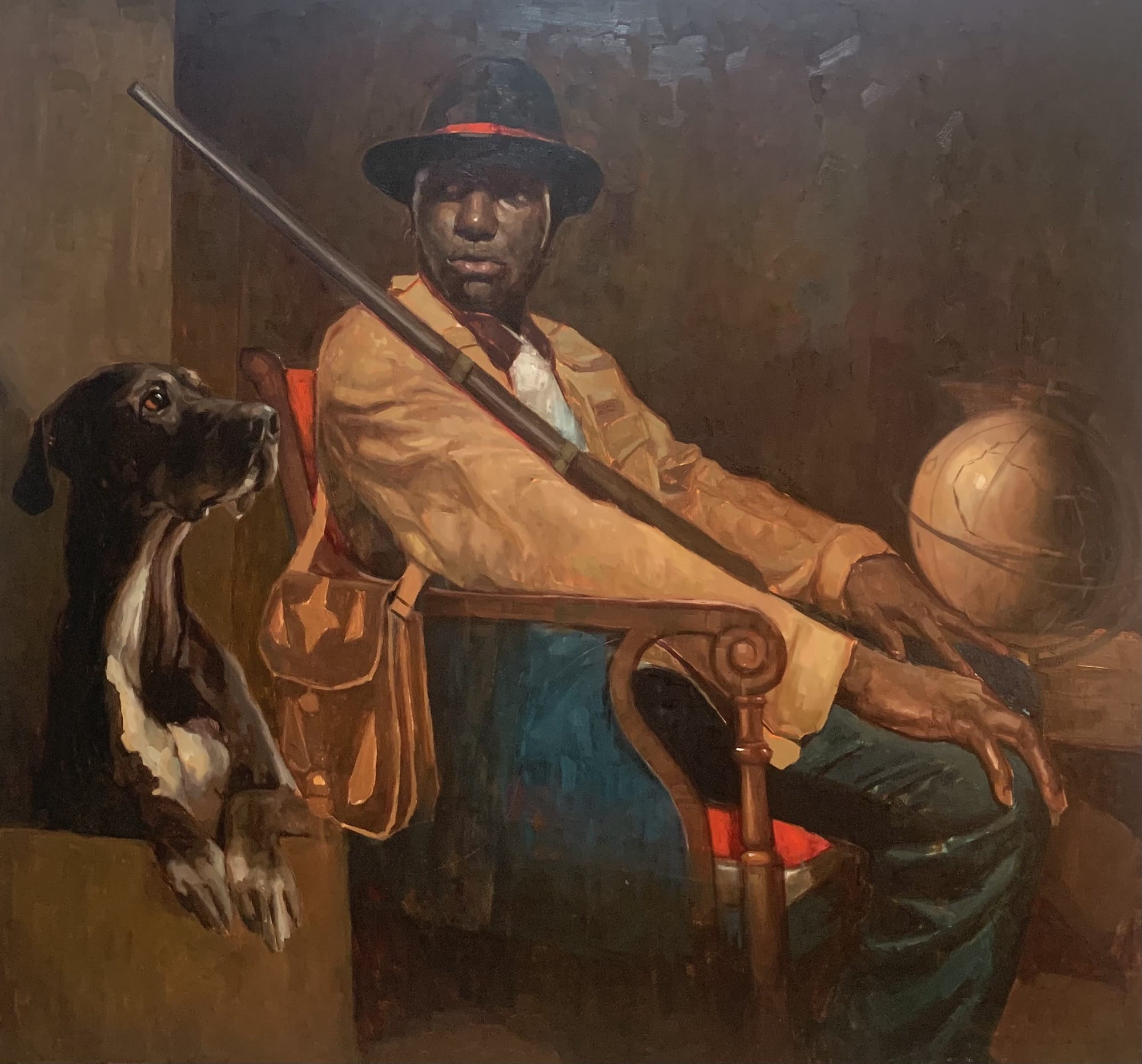 a portrait of a man seated with a gun and hunting dog next to him