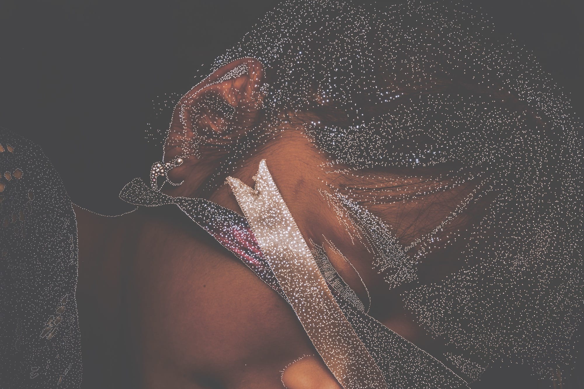 small holes pierce a dark photo of a close up shot of a child