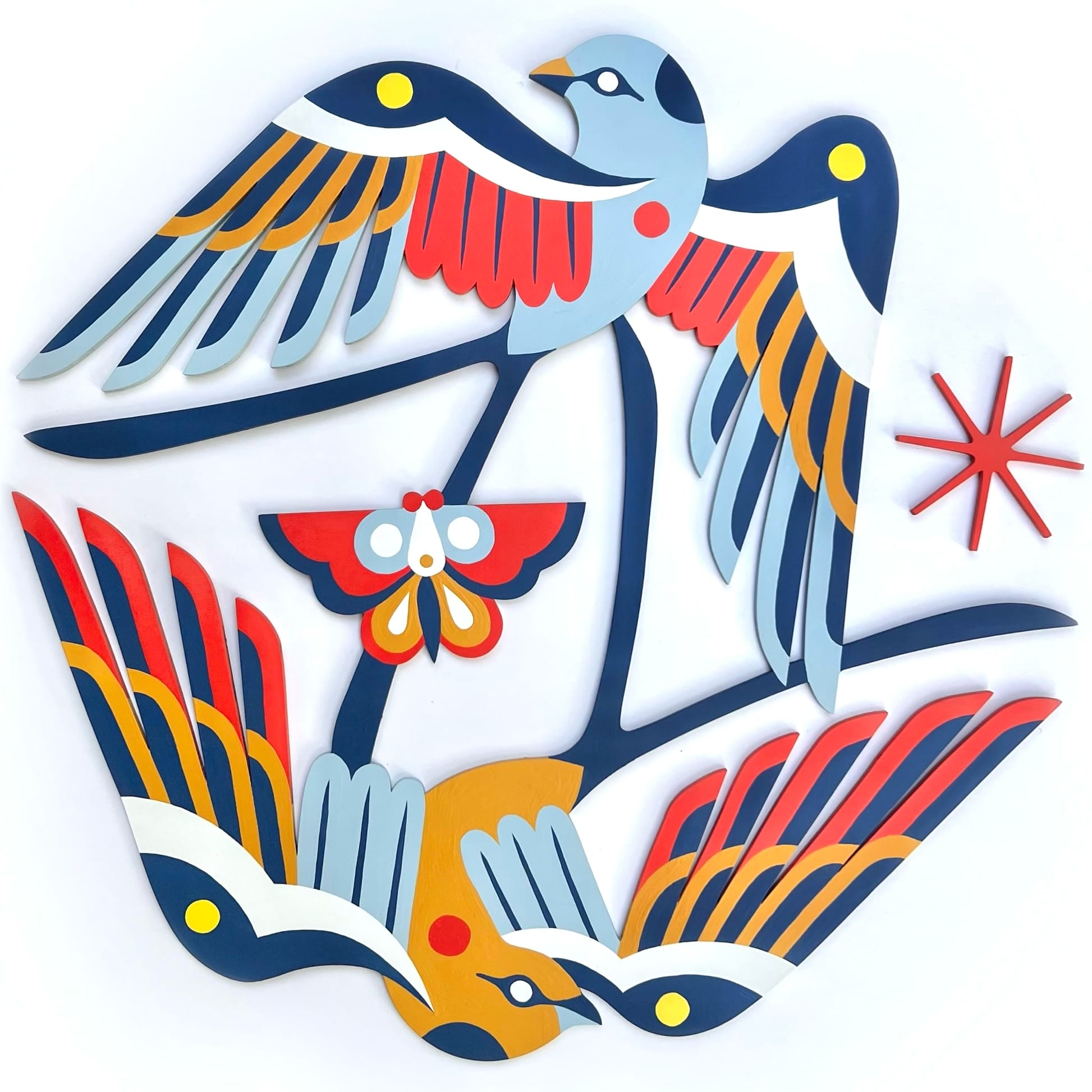 two birds in blue, red, and yellow flying in a circle