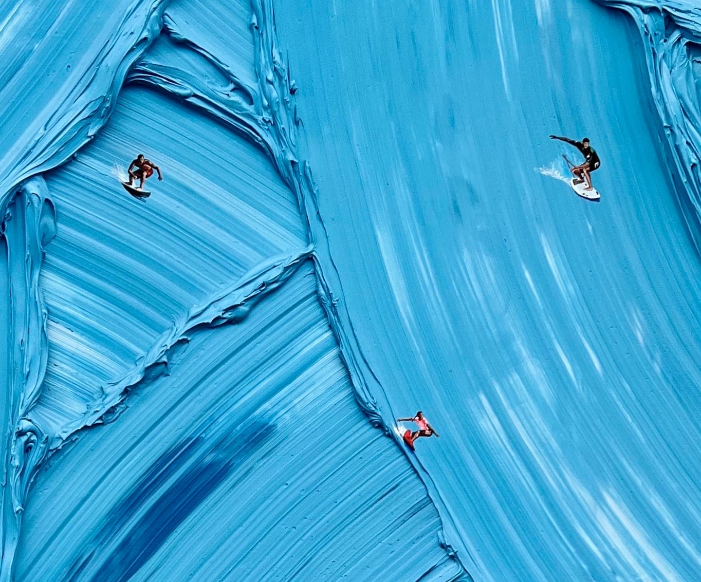 people surfing on blue impasto strokes