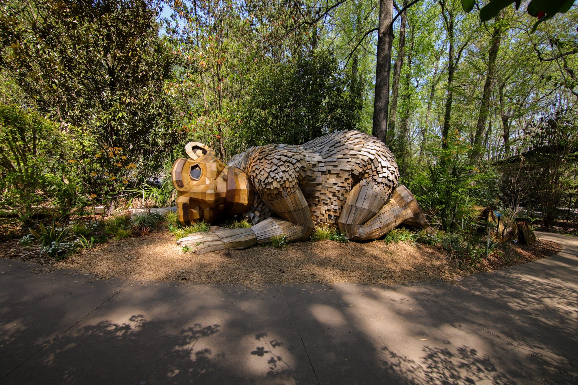a giant wood troll with its ear to the ground