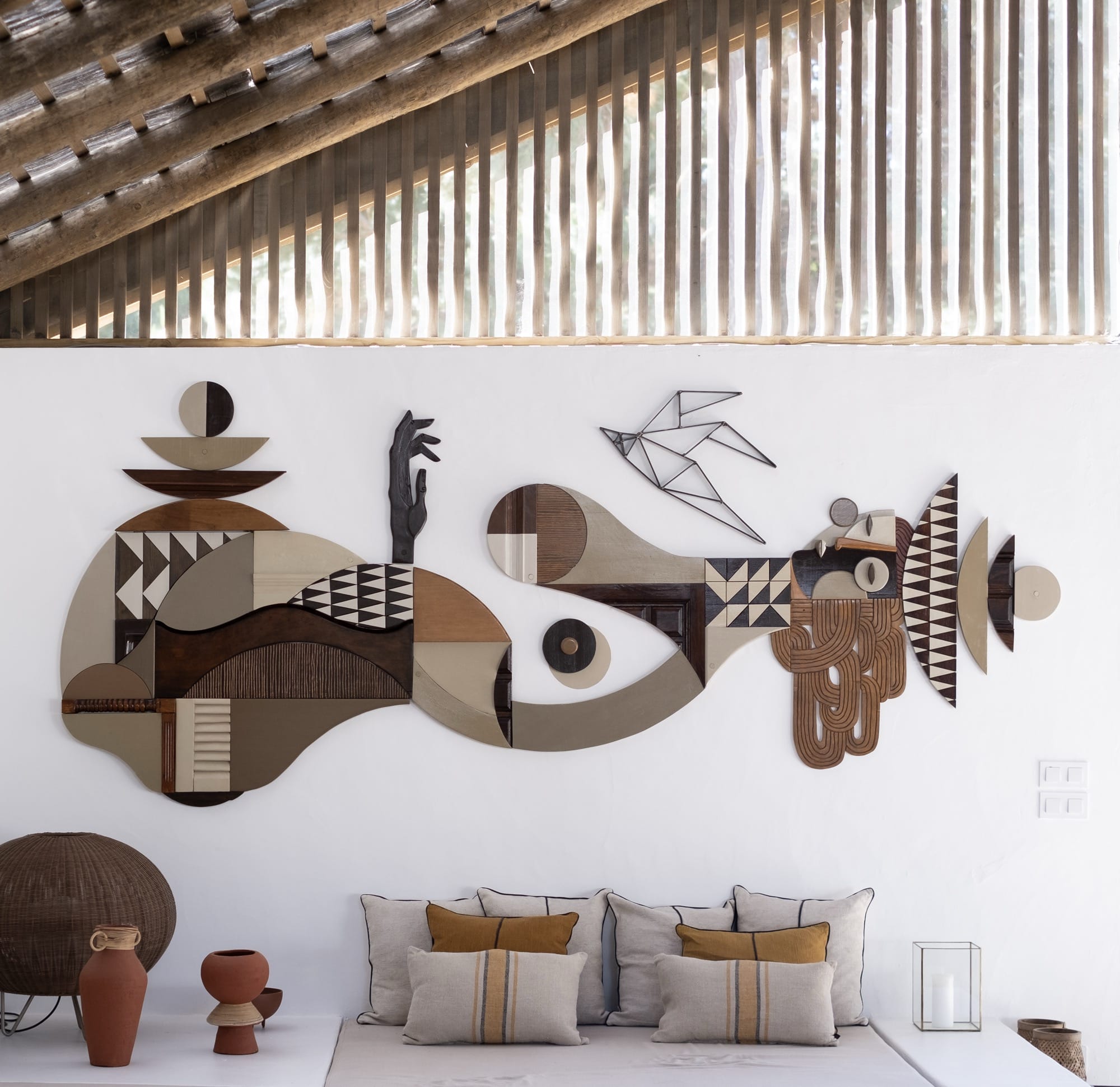 a wall installation by Expanded Eye made of wood in various patterns, colors, and textures