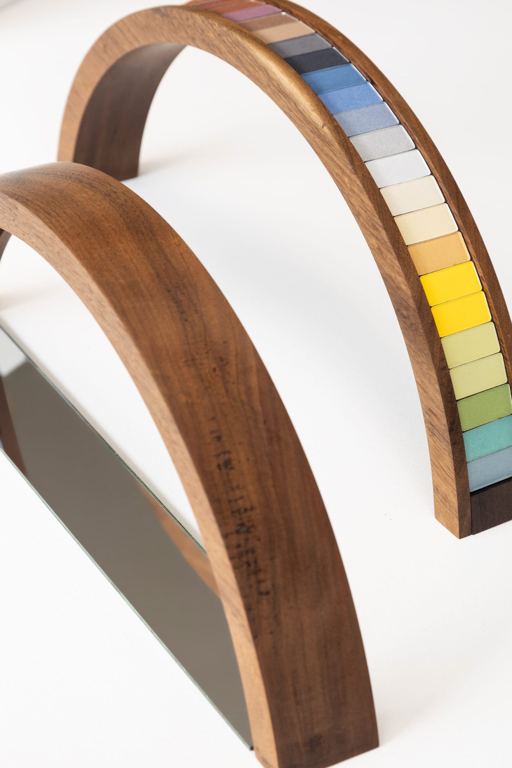 two arched wood works with colorful eyeshadow palettes