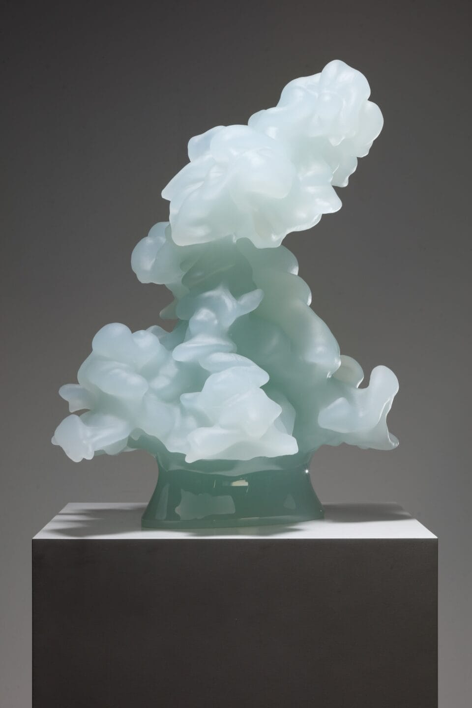 a cast glass sculpture of a cumulus cloud