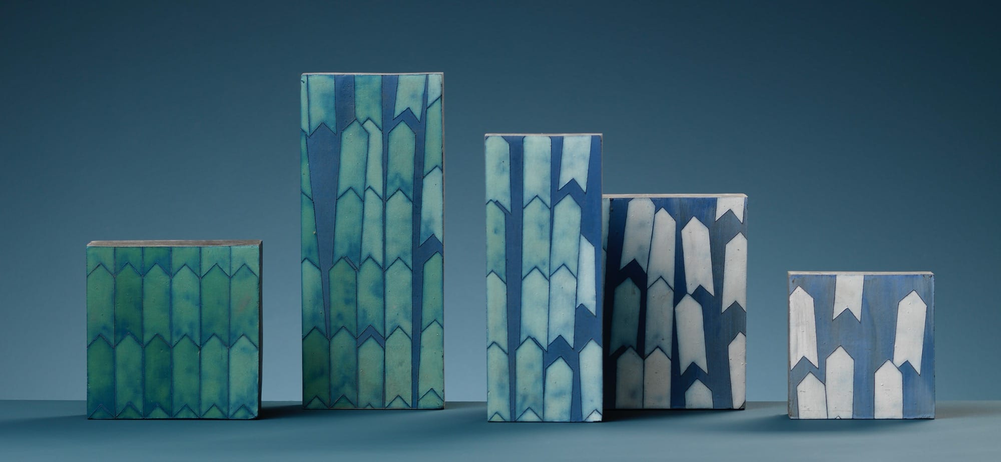 a series of patterned ceramic tablets