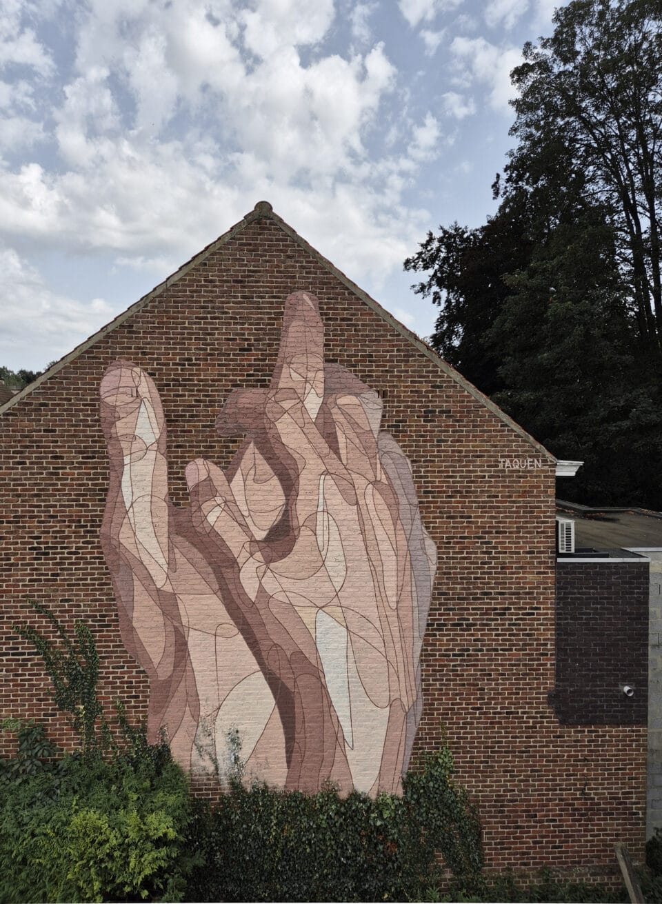 a mural of two interlocked hands